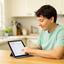 Poco Vieu, neurodivergent adult, organizing daily tasks with a tablet in a bright kitchen