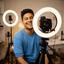 Westly Luqueno, content creator, filming with a ring light in a home studio
